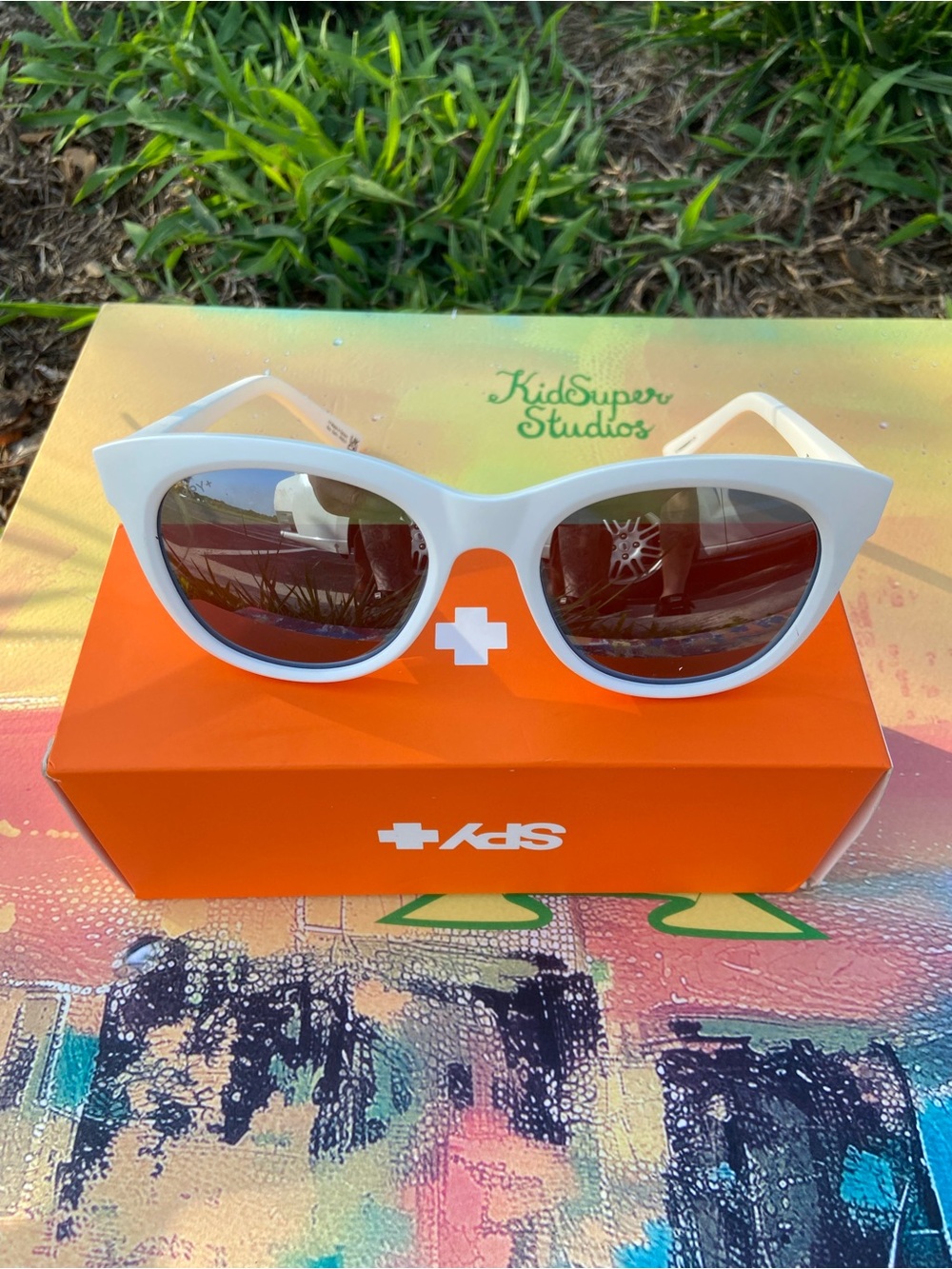SPY Boundless White Cat-Eye Sunglasses with spectral mirror lenses